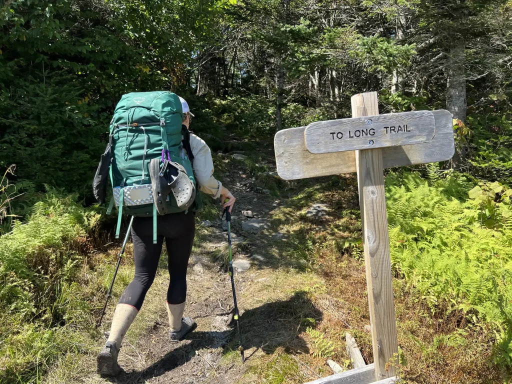 Hiker + trail sign_Mad River_09-03-2023_Houze