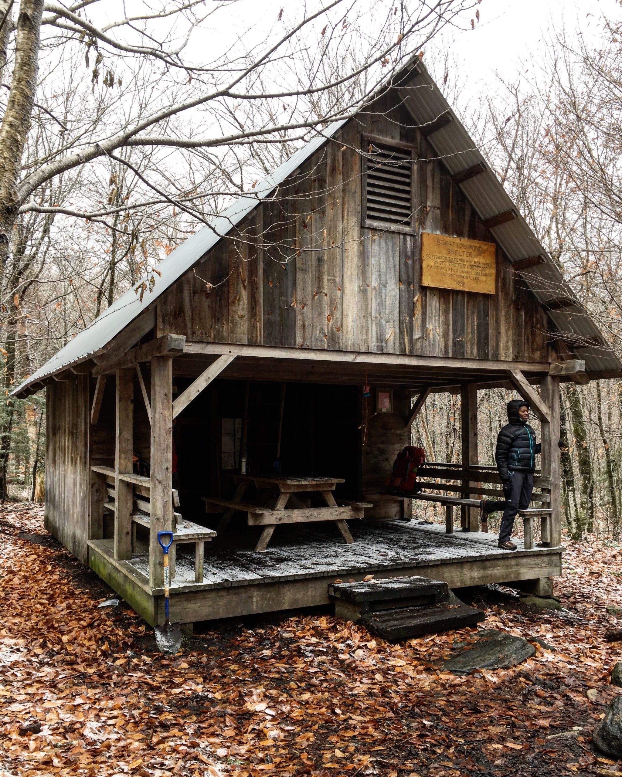 Mardi Fuller stands on the porch of the Stratton Pond Shelter on the Long Trail.